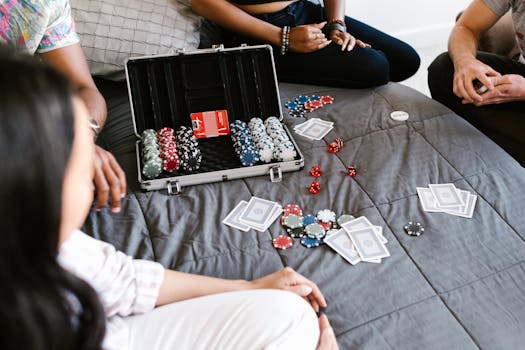 Friends enjoying a casual poker game in a relaxed, indoor setting.
