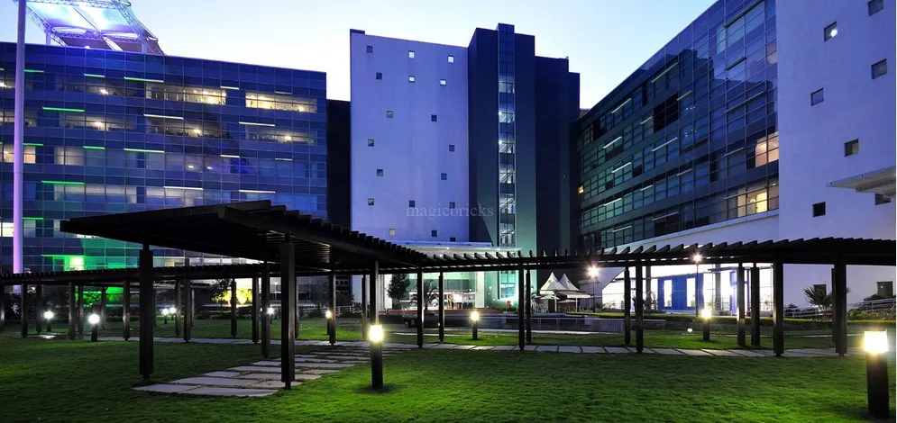 A photograph of a company in Salarpuria Softzone during night time.