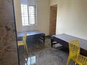 Photograph of a 2-sharing bedroom in a coliving pg.