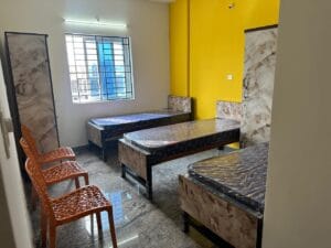 Photograph of a 3-sharing bedroom in a coliving pg.
