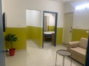 A photograph of a bedroom in a coliving pg.