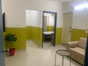 A photograph of a bedroom in a coliving pg.