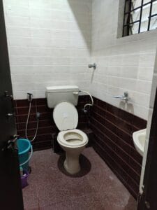 A photograph of a toilet in a coliving pg.