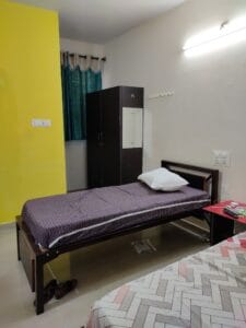 A photograph of a 2-sharing room in a coliving pg.
