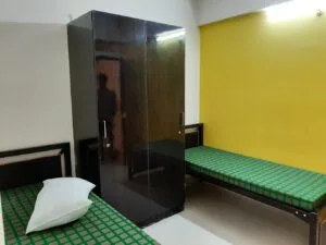 A photograph of a 2-sharing bedroom in a coliving pg.