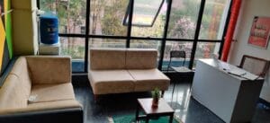 Photograph of a sofa in a coliving pg.