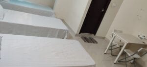 Photograph of a 3-sharing bedroom in a coliving pg.