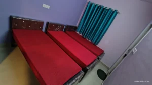 Photograph of 3-sharing bedroom in a coliving pg.