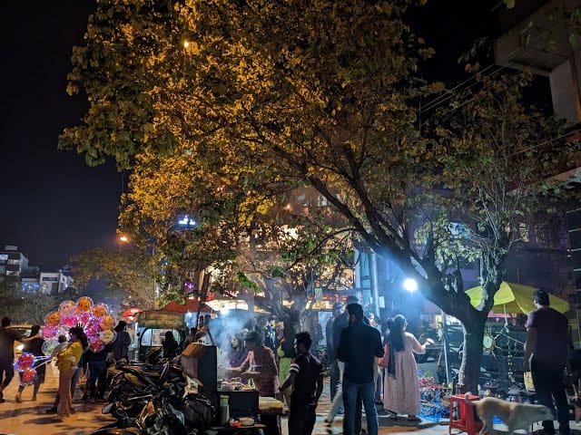 Photograph of a busy street in bangalore during nighttime.