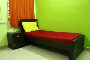 A photograph of a single sharing room in a coliving PG.