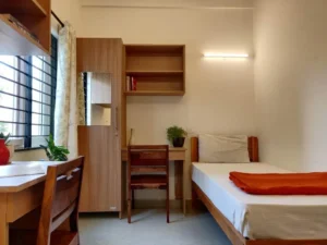 Photograph of the bedroom in a coliving PG in Arekere.