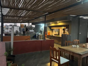 Photograph of the dining hall in a coliving PG in Arekere.