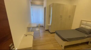 Photograph of a bedroom in a luxurious coliving PG.