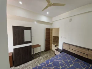 A photograph of a single sharing room in a coliving pg in Bannerghatta.